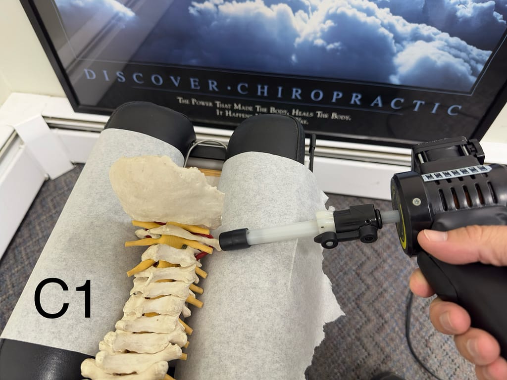 Linwood chiropractor shows where you adjust the C1 bone to relieve the nerves that travel through this area
